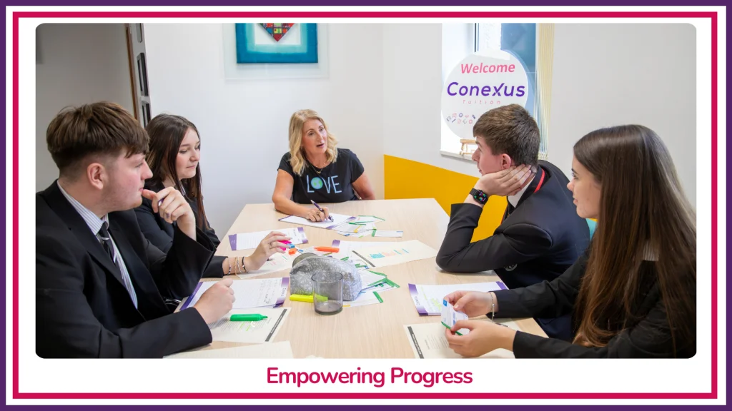 A Conexus Tuition tutor leading a small-group session with four secondary-age students around a table beneath a 'Welcome to Conexus' wall display, captioned 'Empowering Progress'