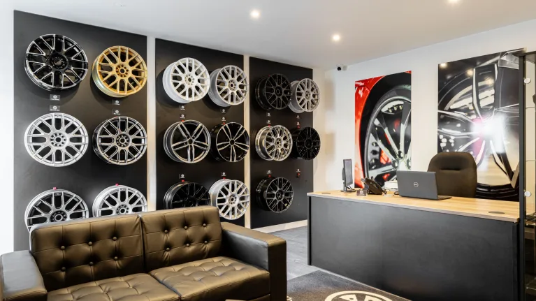 The Wheel Specialist franchise showroom interior with refurbished alloy wheels on display